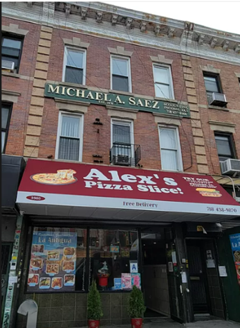 A three-story brick building with a ground-floor pizzeria under a red awning named "alex's pizza slice." a sign for "michale a. saez attorney at law" hangs above on the second floor.