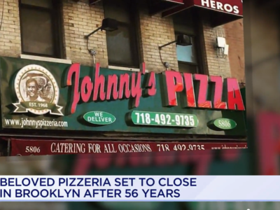 Storefront of "johnny's pizza" in brooklyn, featuring a red and green sign, with phone numbers and website listed, under a news banner announcing its closure after 56 years.